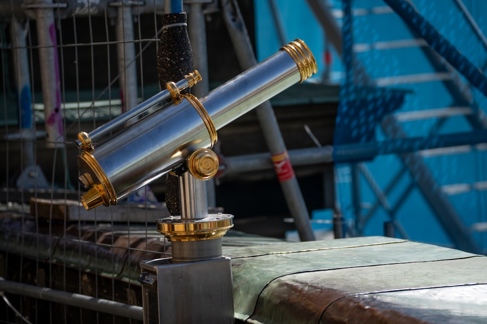 a telescope sitting on top of a metal table