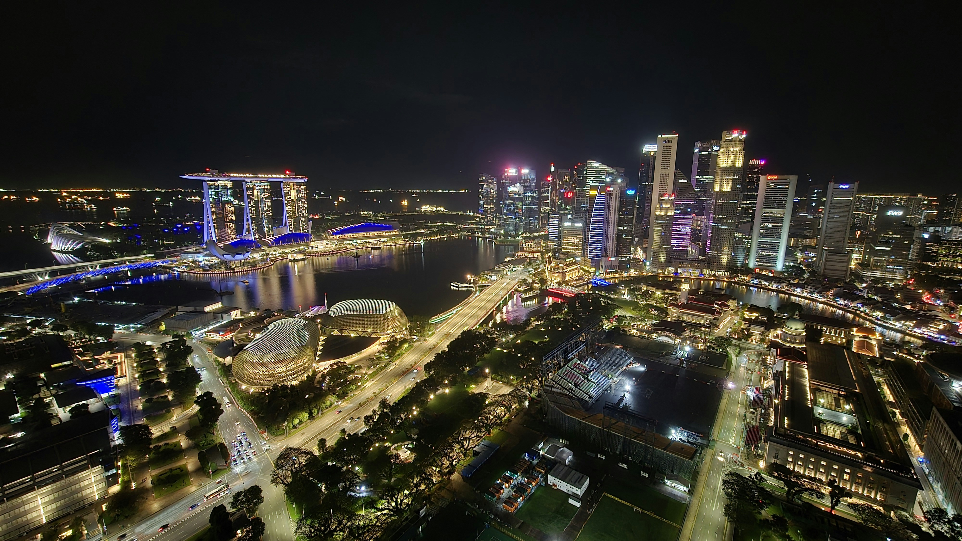 Singapore city skyline at night with modern buildings and lights