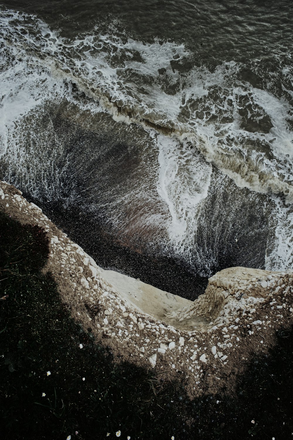 a large body of water with waves crashing over it