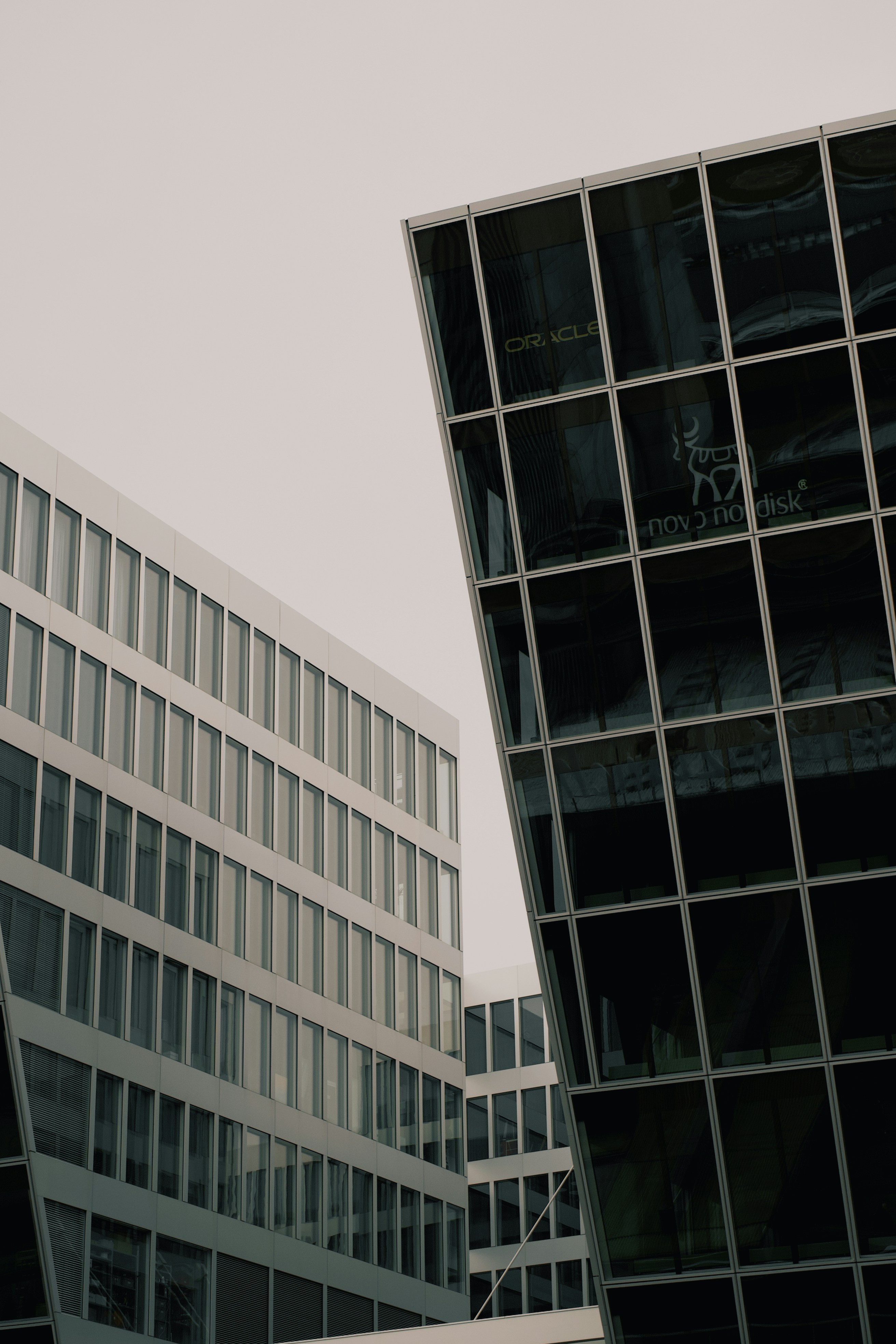 a couple of tall buildings sitting next to each other