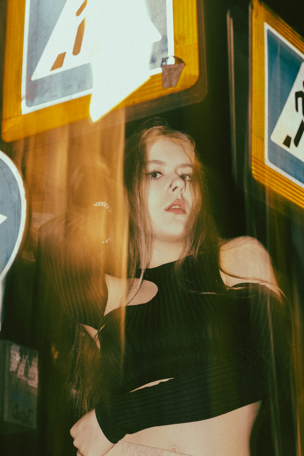 a woman standing in front of a bus window