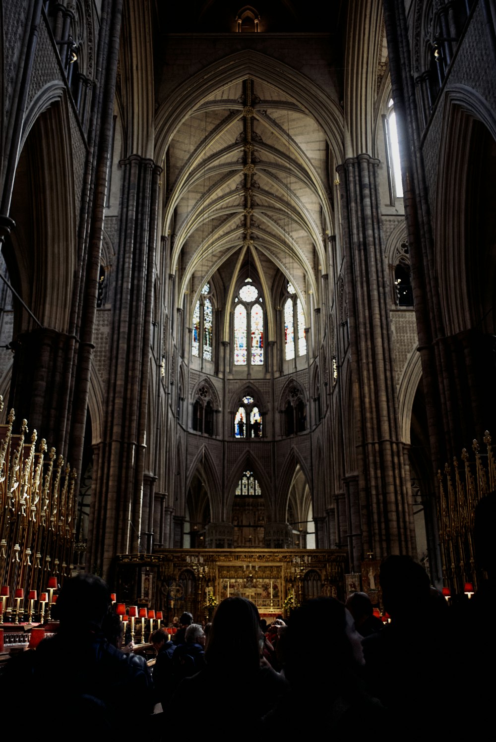 a group of people standing in front of a cathedral