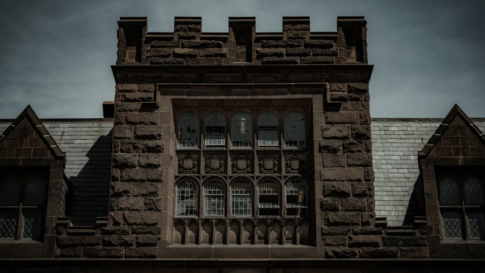 an old building with a clock on the front of it