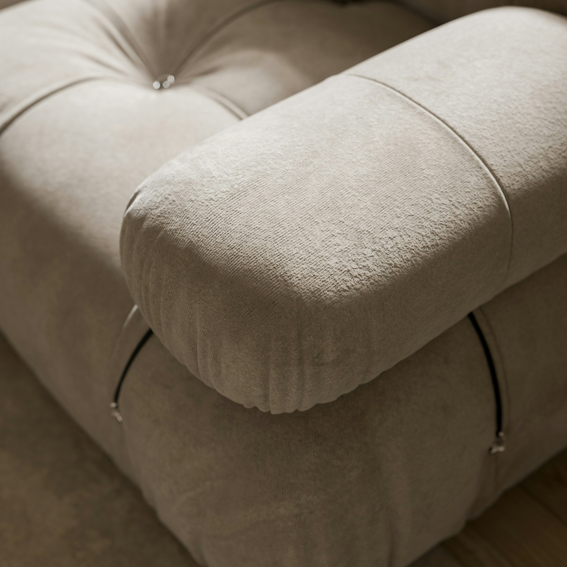 a close up of a couch with a pillow on top of it