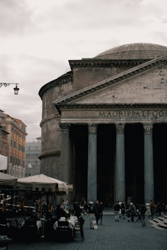 a group of people standing outside of a building