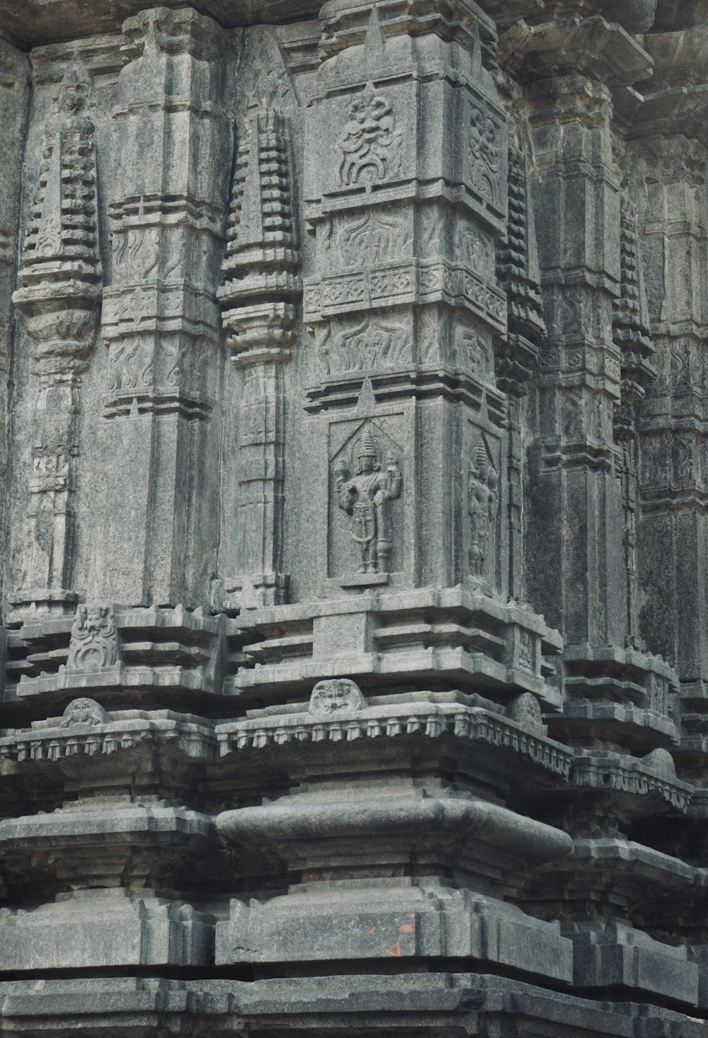 a close up of a stone structure with carvings on it