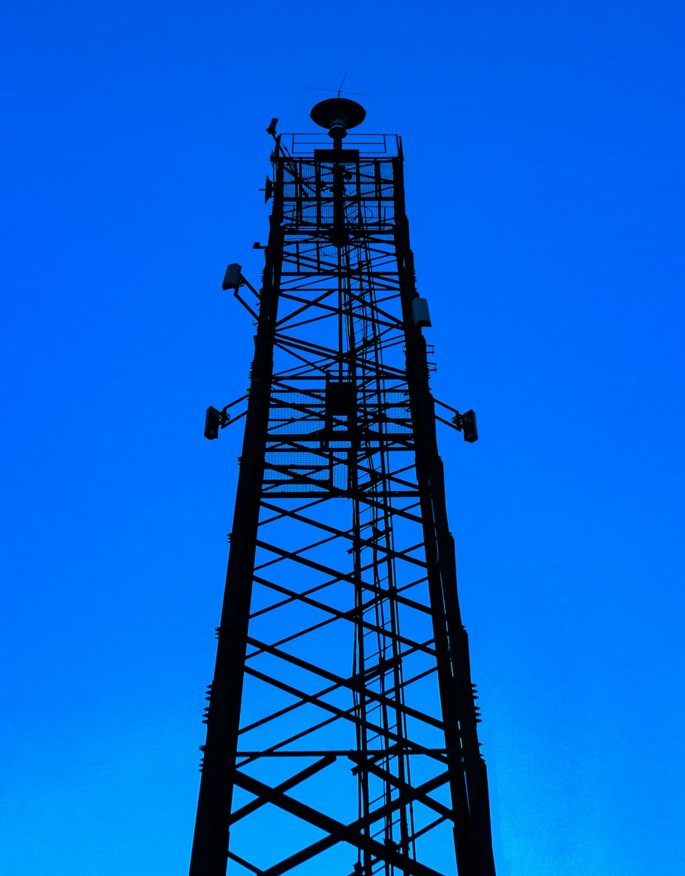 a tall tower with a clock on the top of it