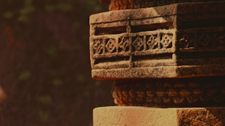 a close up of a brick structure with a tree in the background