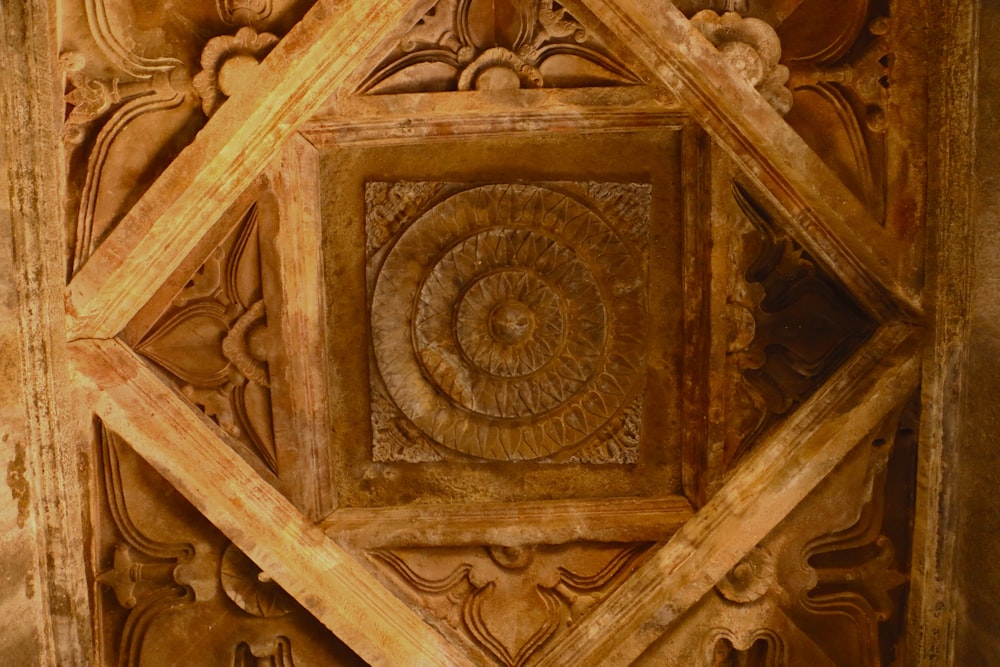 a wooden wall with a decorative design on it