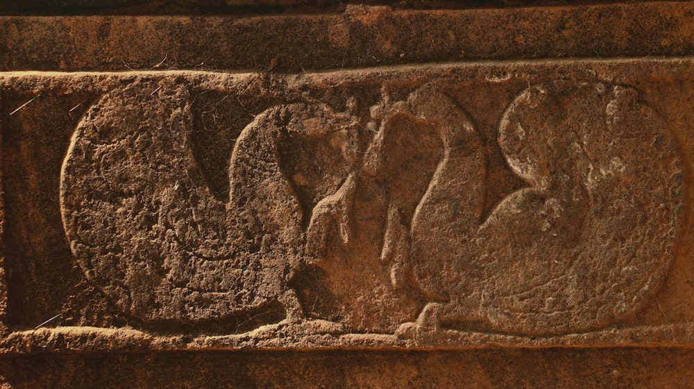 a close up of a carving on a wall