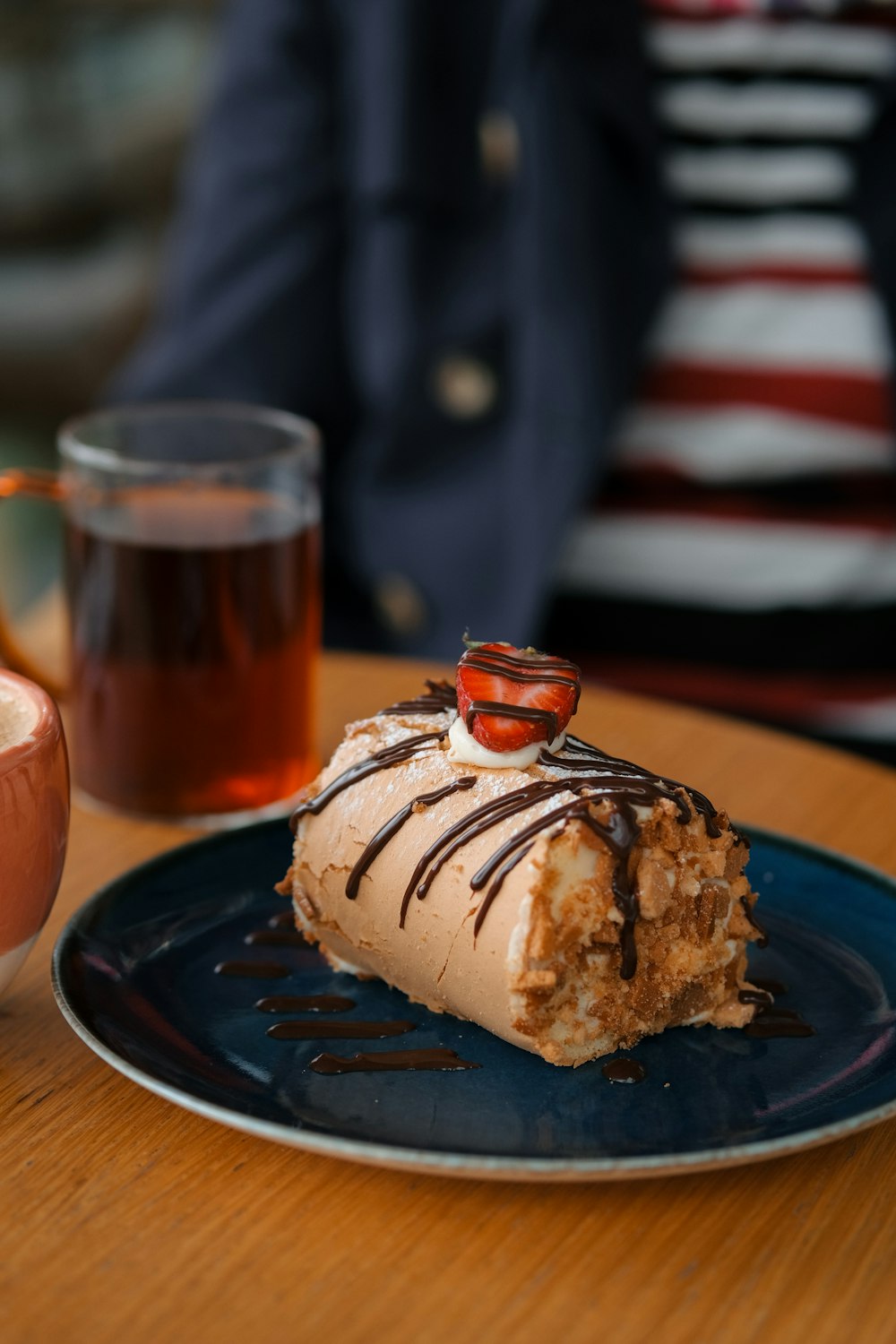 a piece of cake sitting on top of a blue plate