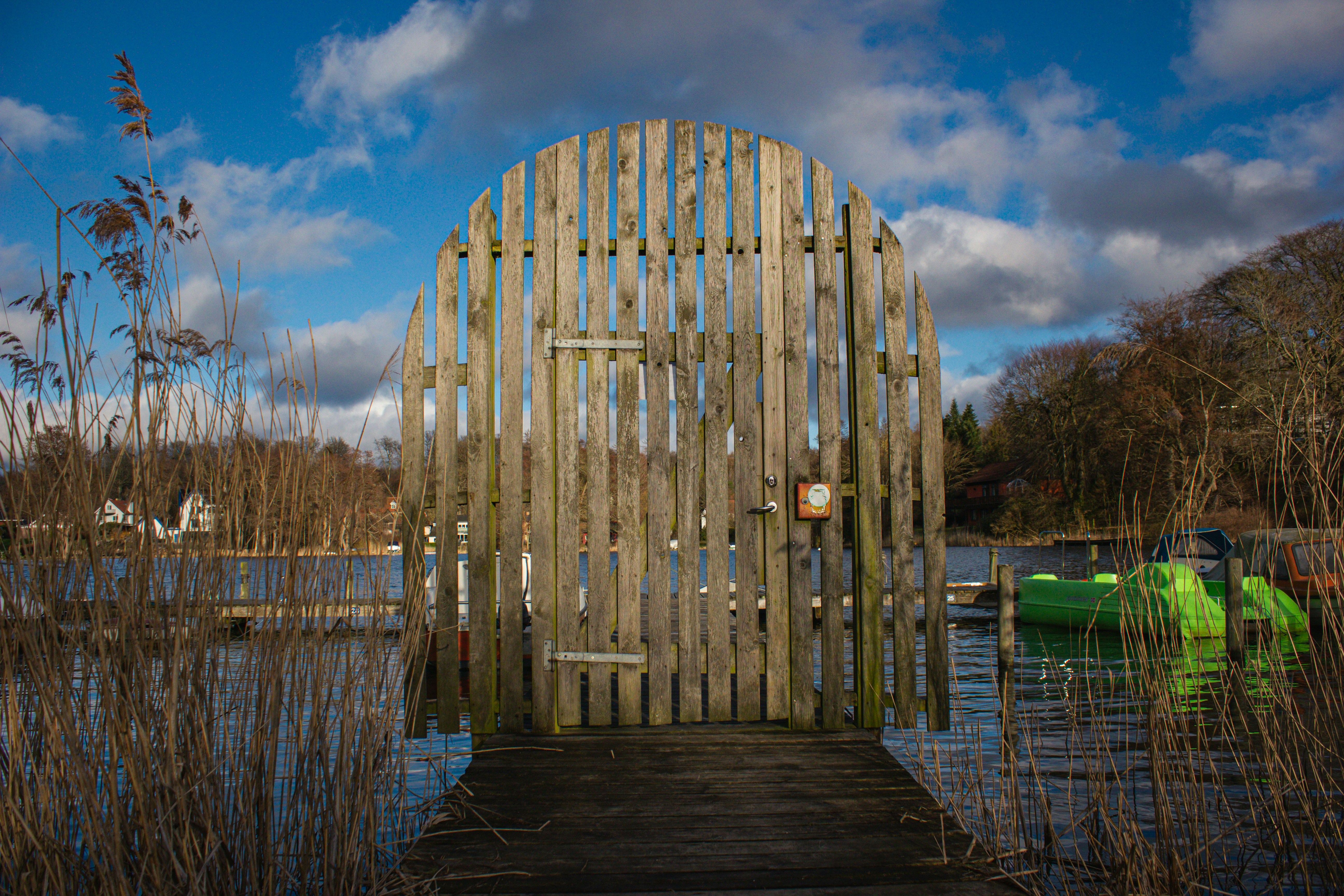 a wooden structure sitting on top of a body of water