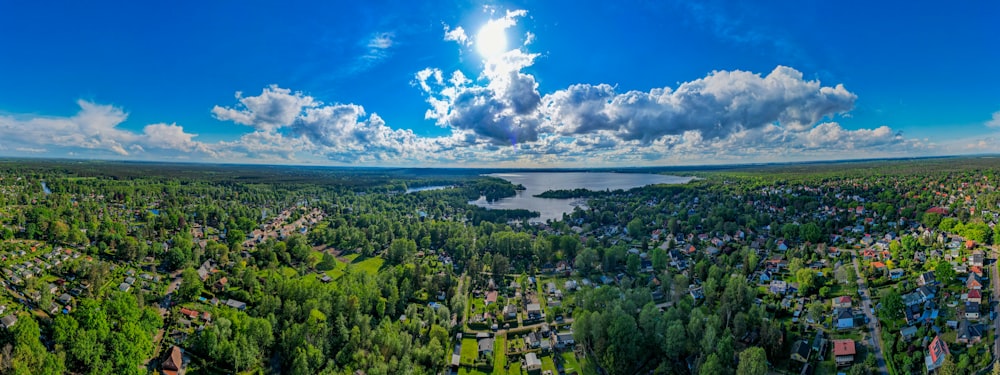a panoramic view of a lake surrounded by trees