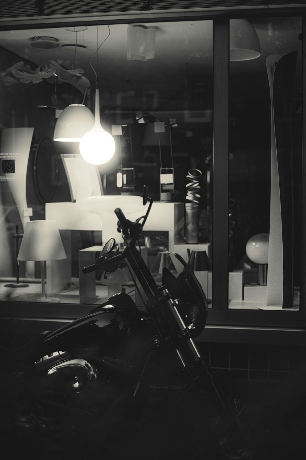 a motorcycle parked in front of a store window