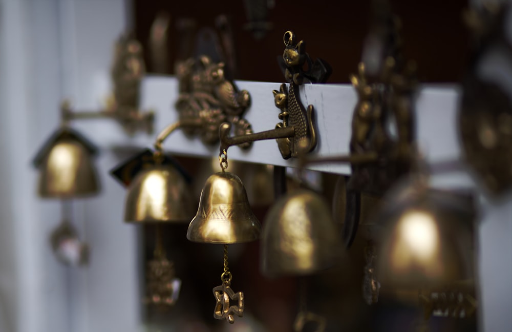 a bunch of bells that are hanging on a wall