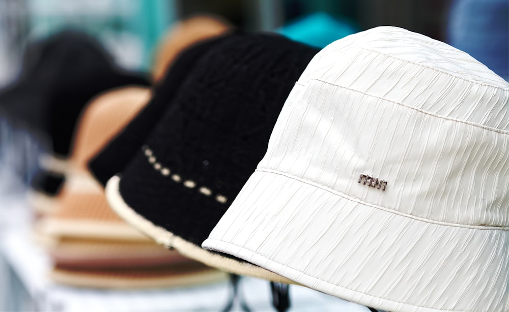 a row of hats sitting on top of a table