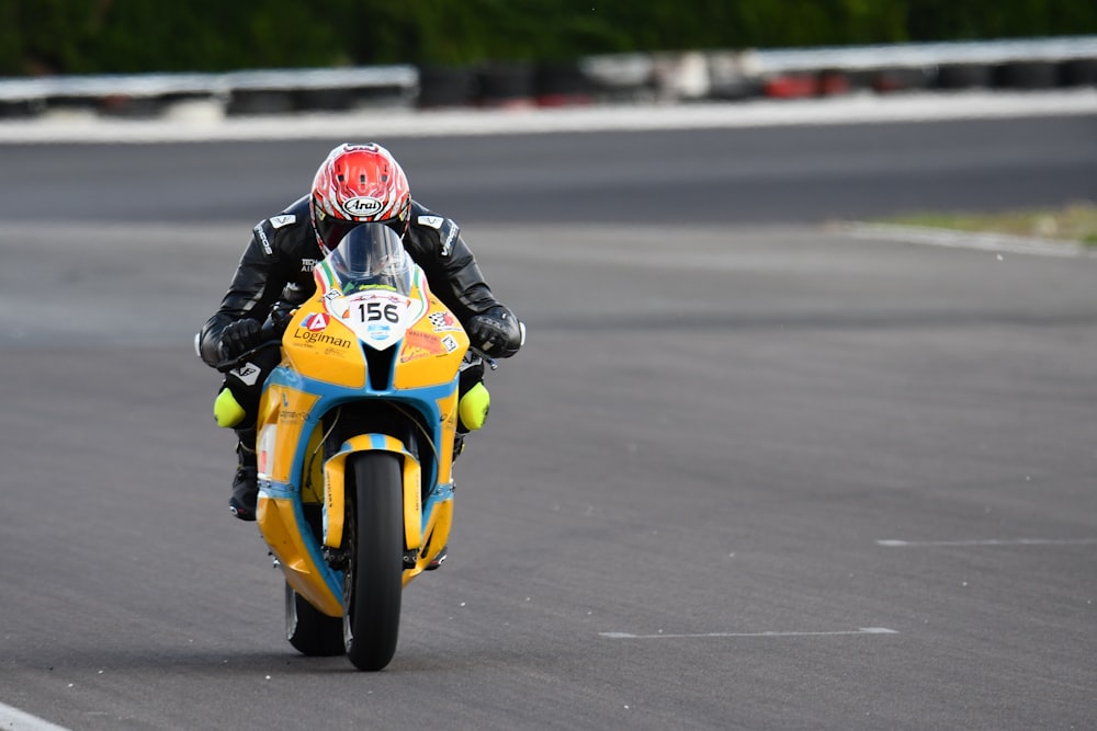 a person riding a motorcycle on a race track