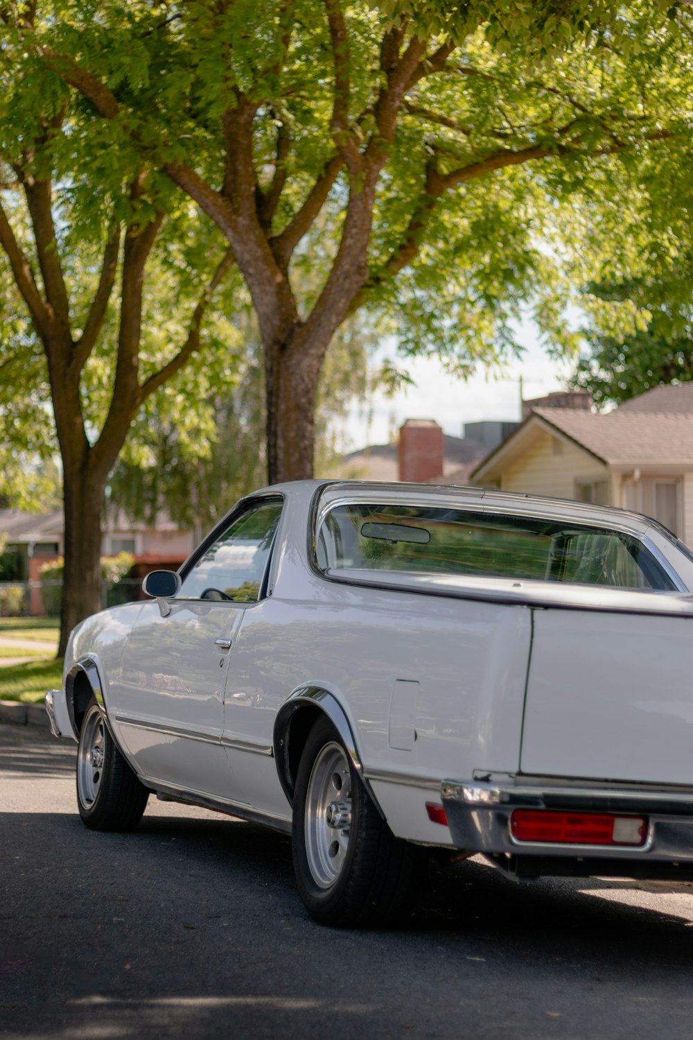 a white car parked on the side of the road