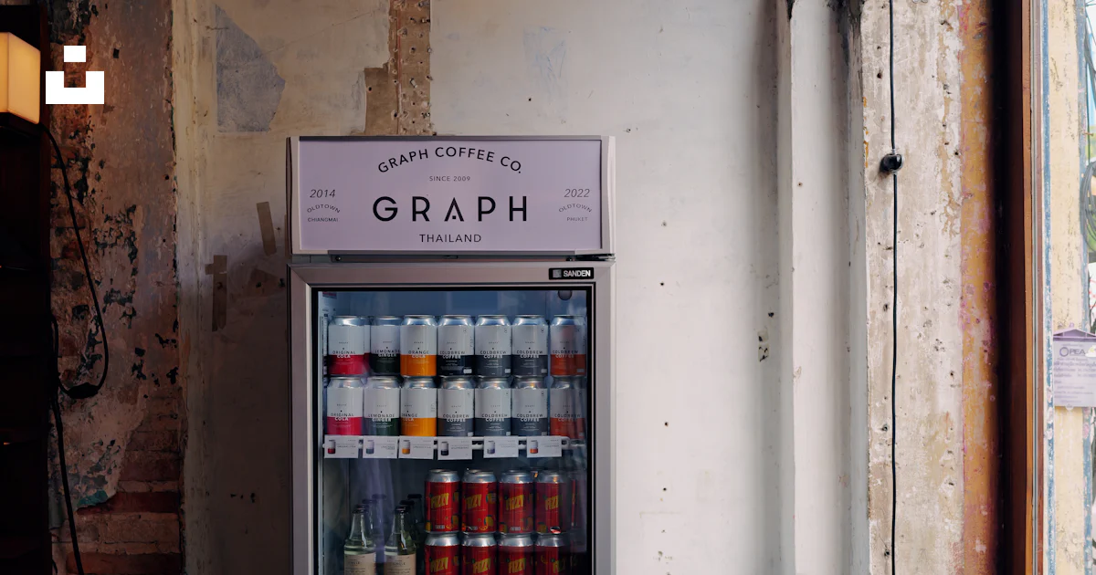 A vending machine sitting in front of a window photo – Free Grey Image ...