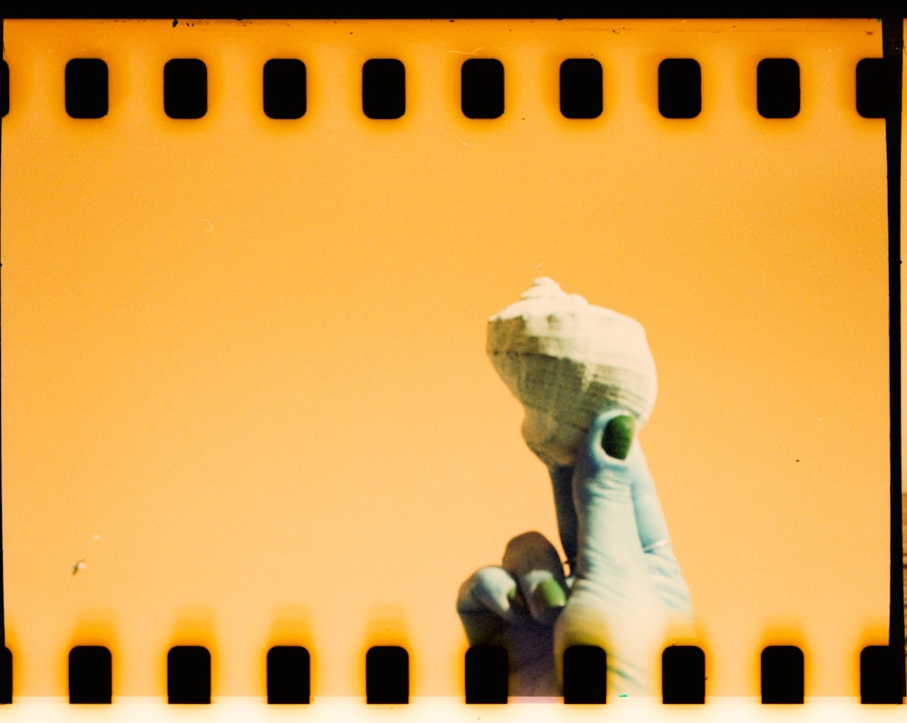 a film strip with a picture of a hand holding a toothbrush