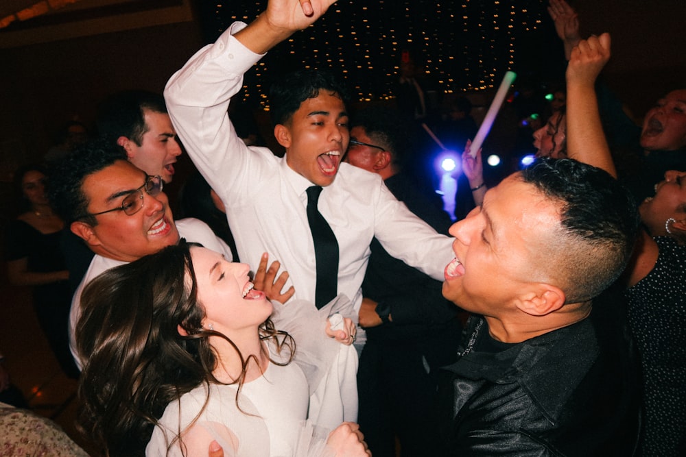 a group of people dancing at a party