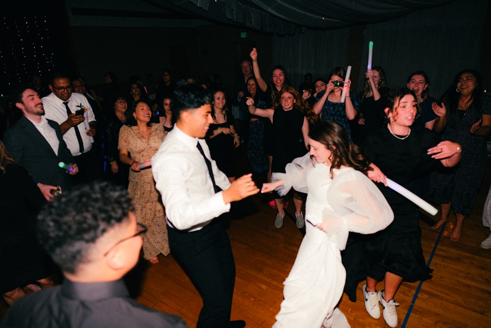 a couple of people that are on a dance floor