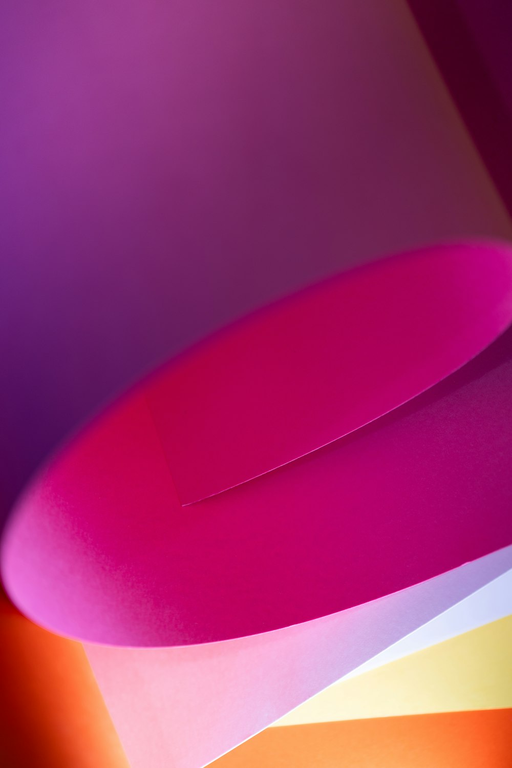 a close up of a pink and purple object