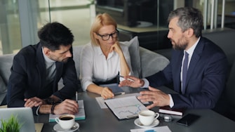 a group of people sitting around a table