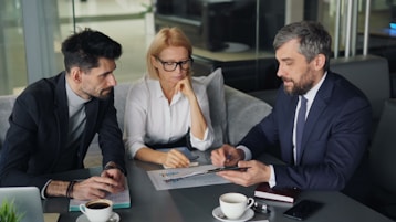 a group of people sitting around a table