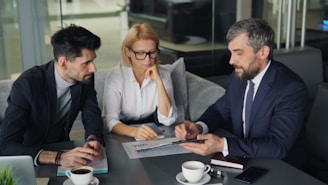 a group of people sitting around a table