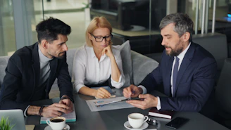 a group of people sitting around a table