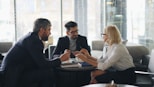 a group of people sitting around a table