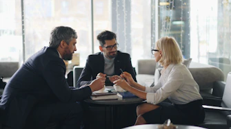 a group of people sitting around a table