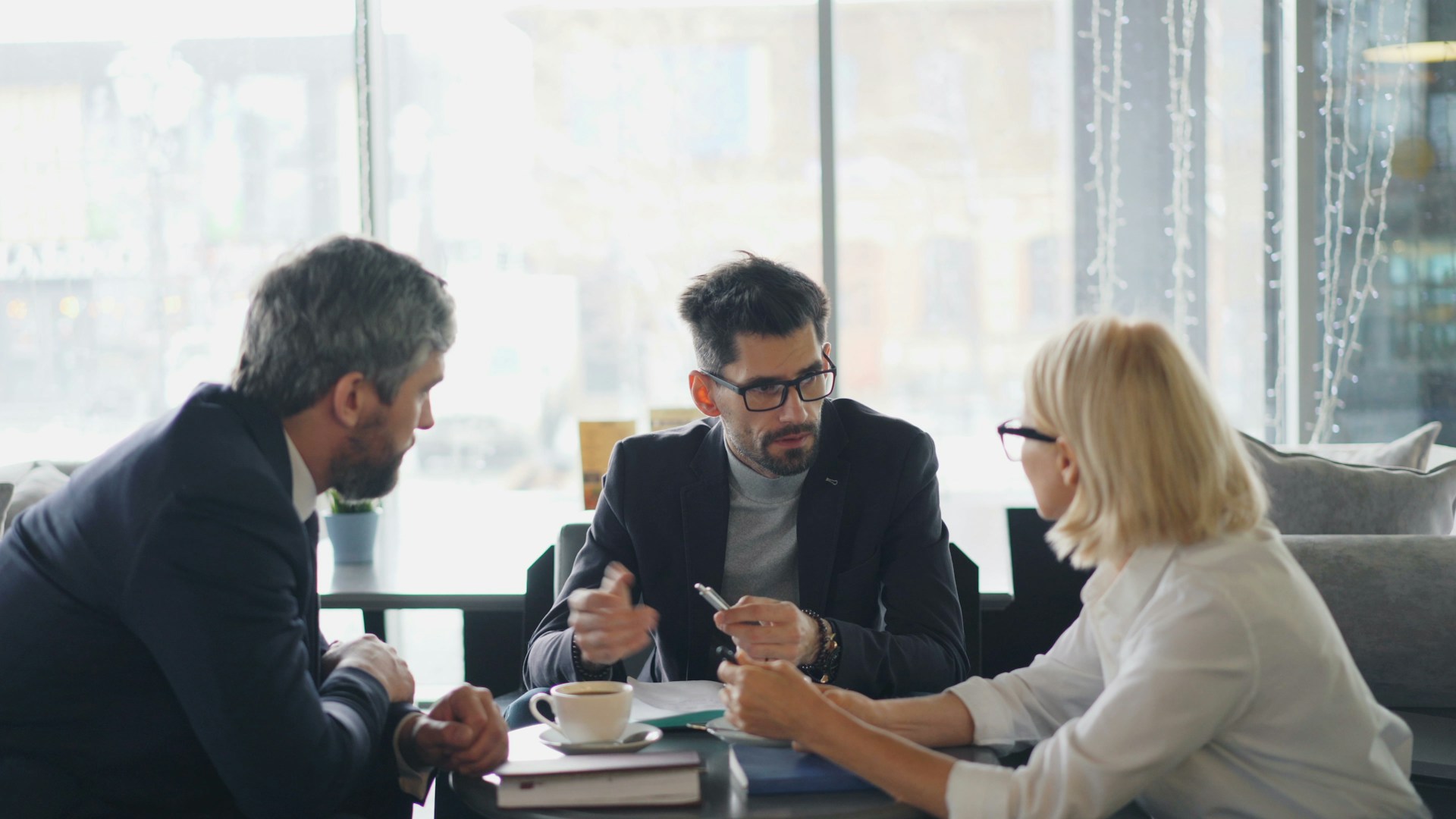 a group of people sitting around a table