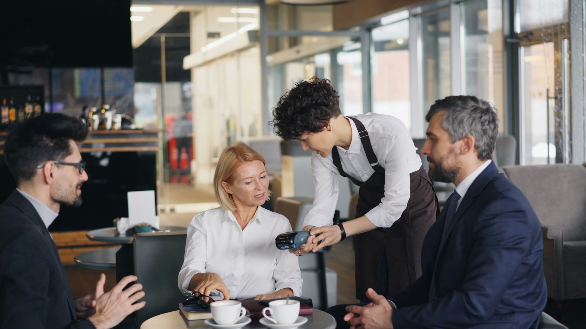 a group of people sitting around a table