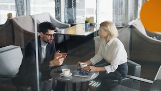 a man and a woman sitting at a table