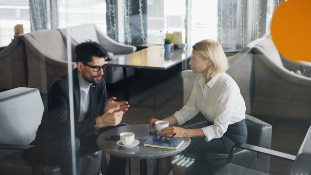 a man and a woman sitting at a table