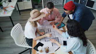 a group of people sitting around a table