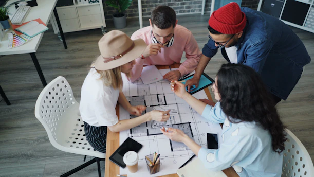 a group of people sitting around a table