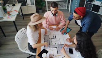 a group of people sitting around a table