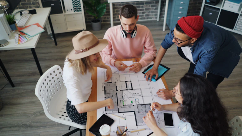 a group of people sitting around a table