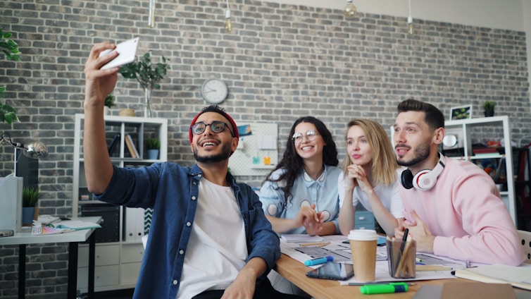 a group of people sitting around a table