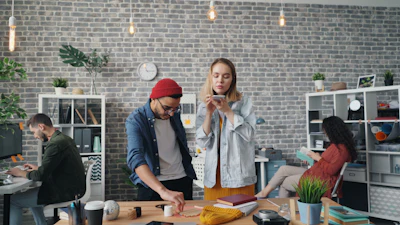 a man and a woman standing in an office