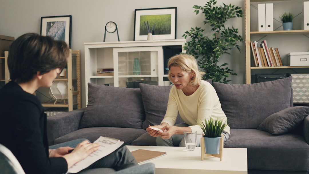 therapist and patient discussing holistic treatment plan