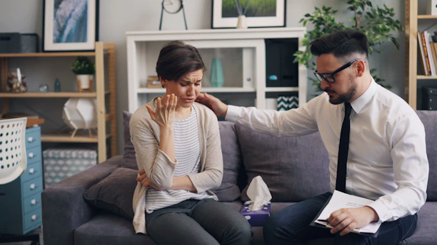 a man and a woman sitting on a couch