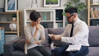 a man and a woman sitting on a couch