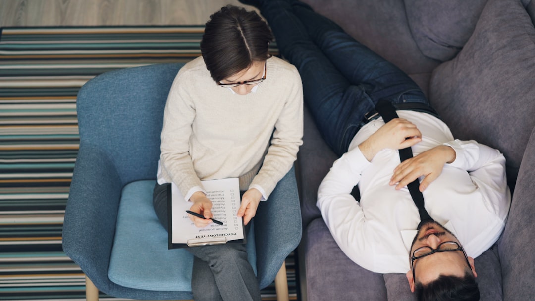 therapist reviewing written treatment plan with client