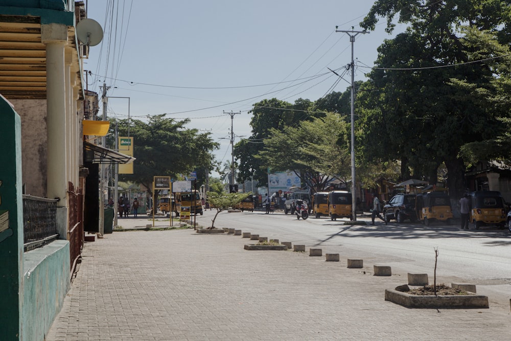 a city street with a few cars parked on the side of the road