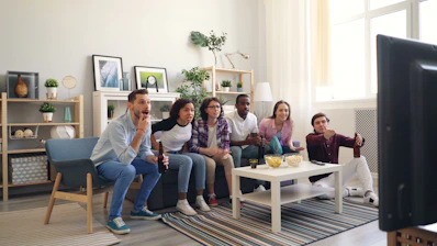a group of people sitting around a living room together