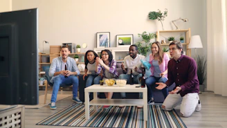 a group of people sitting in a living room